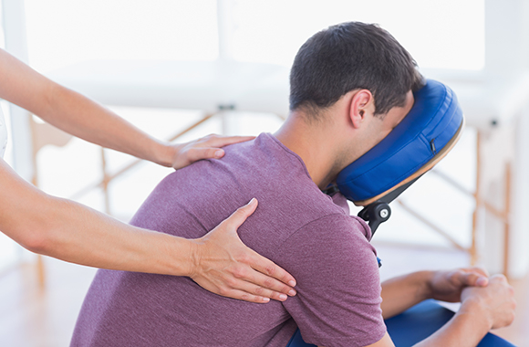 Man receiving chair massage